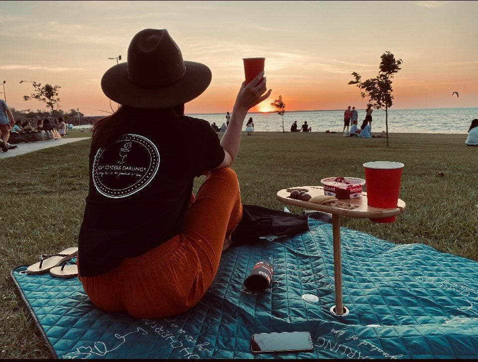 Large Picnic Rug with Travel Wine Table. Person overlooking the sunset